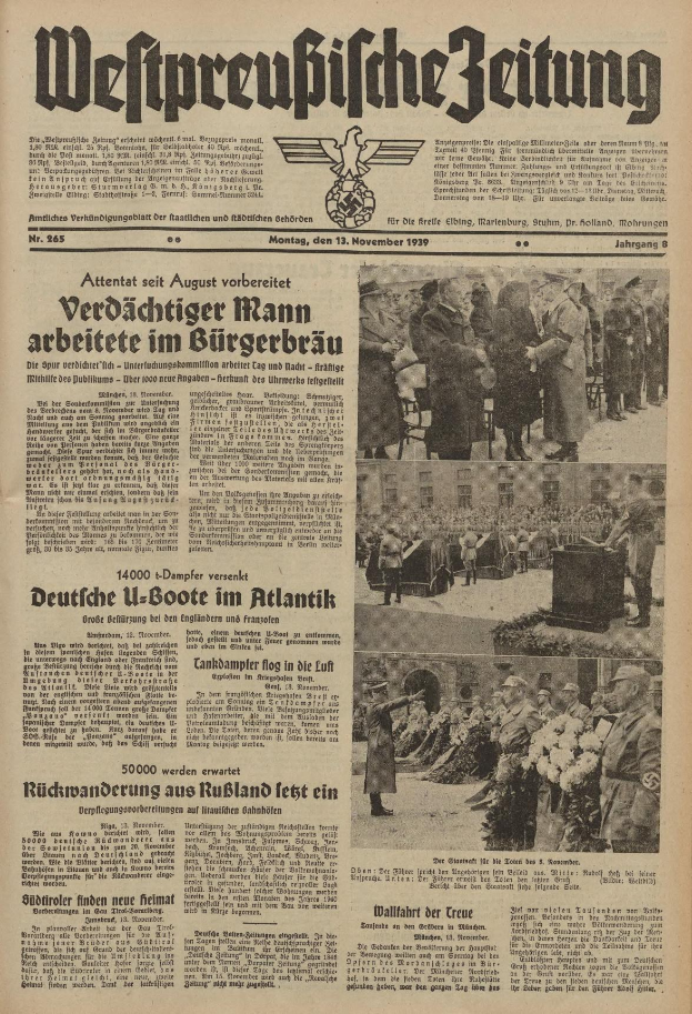 Schwarze und weiße Titelseite einer deutschen Zeitung vom 13. November 1939, betitelt "Weitpreubliche Zeitung", mit einer Gruppe von Menschen in traditioneller deutscher Kleidung auf dem Bild.