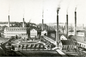 Eine Schwarz-Weiß-Zeichnung einer Fabrik mit Rauch aus dem Schornstein, umgeben von Gebäuden, Bäumen, Pflanzen, Gras und einem Zaun, mit dem Text "New York State Penitentiary" unten.
