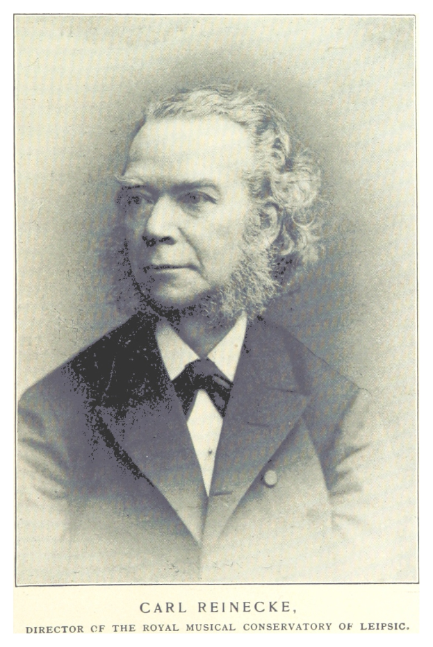 Ein Schwarz-Weiß-Foto von Carl Reinecke, dem Direktor des Königlichen Musikalischen Konservatoriums Leipzig, der einen Anzug trägt, mit Text unten auf dem Bild.